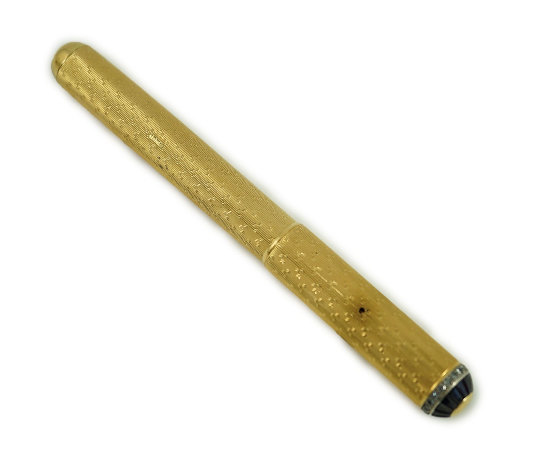 A late 1930's 18ct gold cased and sapphire and diamond set side lever fountain pen, 11cm